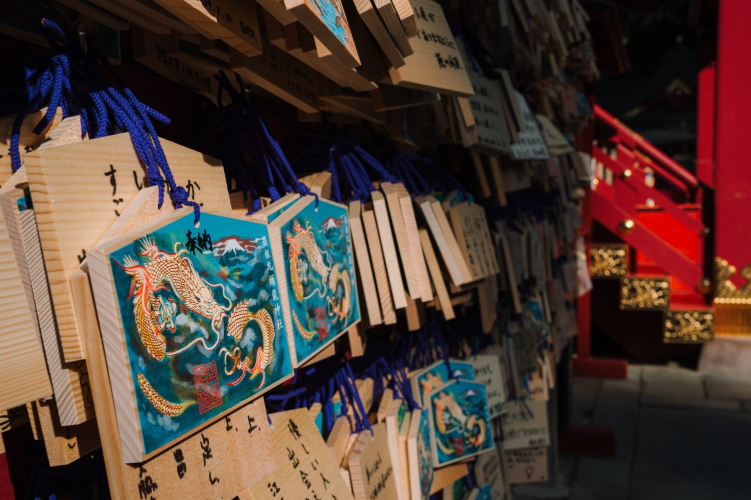 Blue and gold painted dragon "ema" (wooden plaque) at the Hakone Shinto Shrine, in Motohakone-ko, Japan.