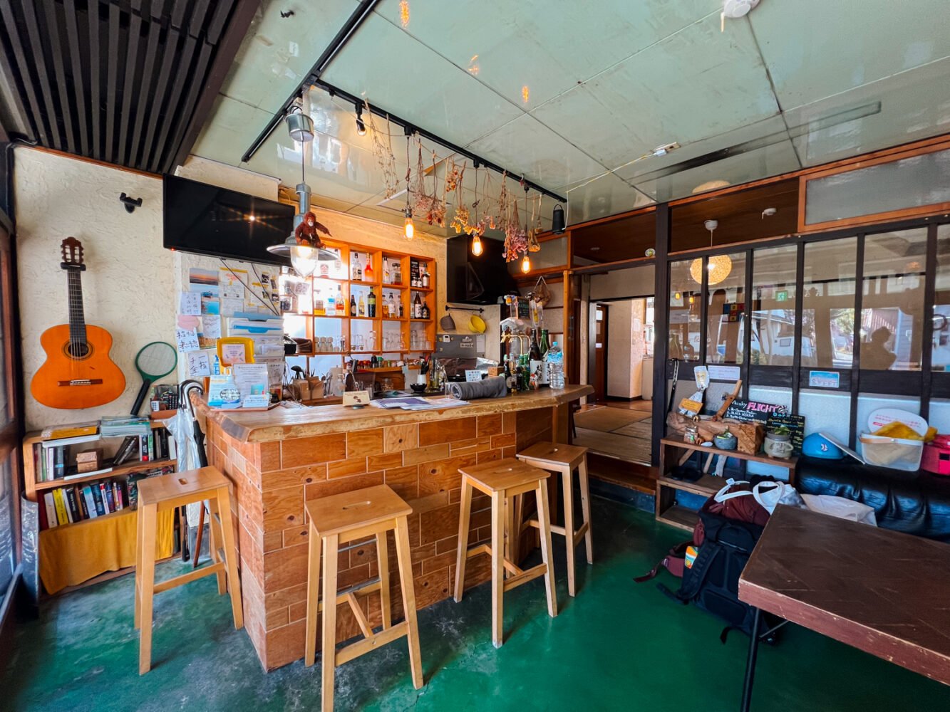 The reception desk and lounge area of the GuestHouse Azito hostel in Hakone, Japan.