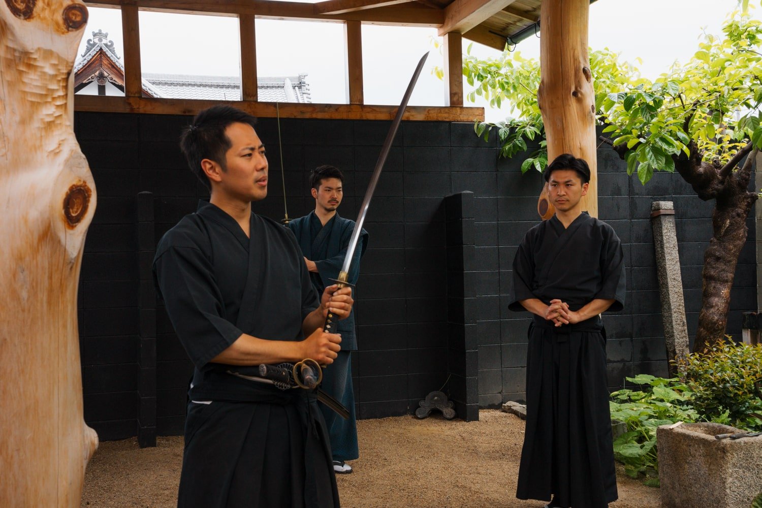 The expert katana sword instructors giving instructions for tourists on the Kyoto Samurai Experience Tour in Japan.