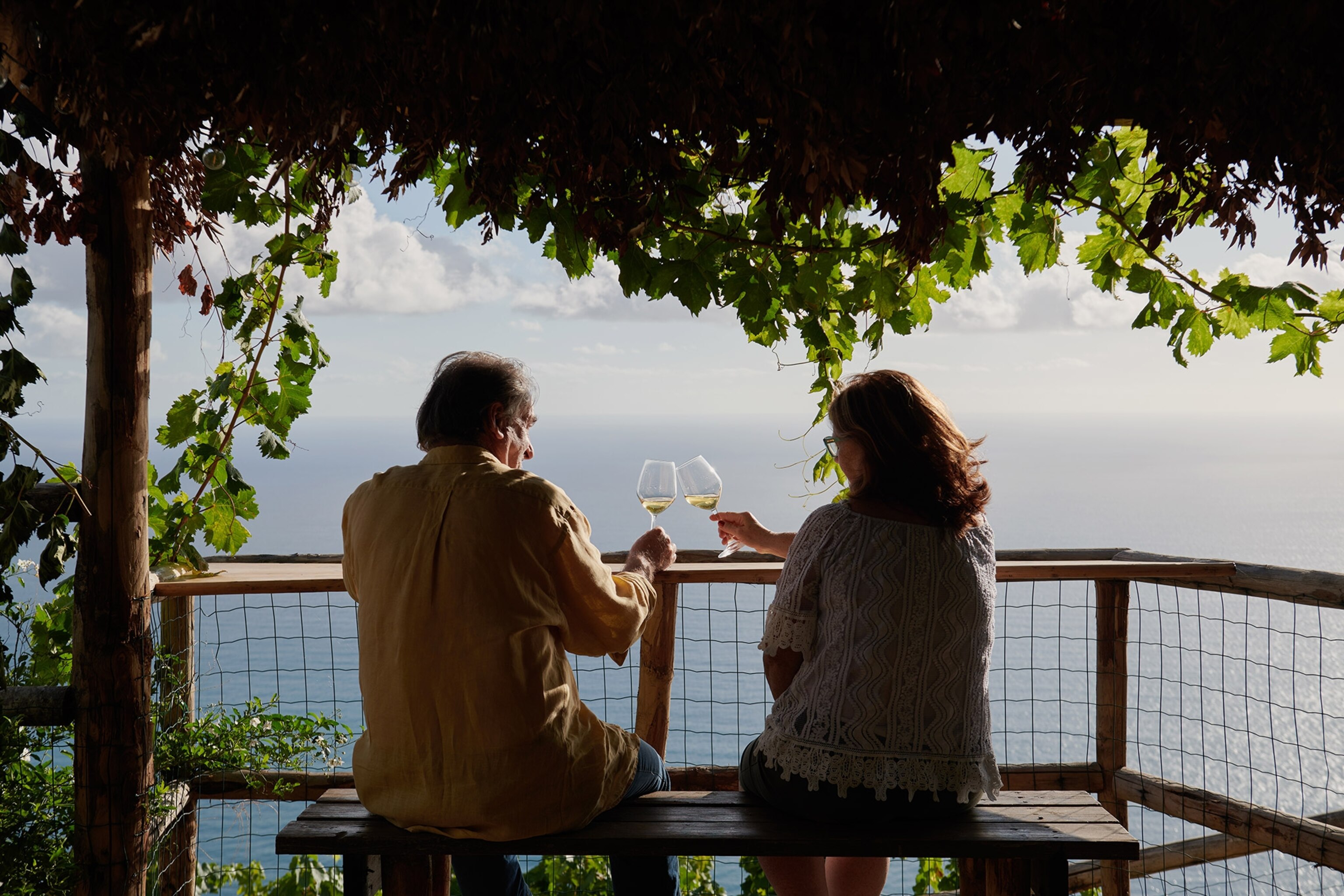 Capellini farm owner Luciano Capellini, tastes a glass of wine with his wife Giuseppina Amico Capellini at one of the wine tasting corners inside one of the vineyards