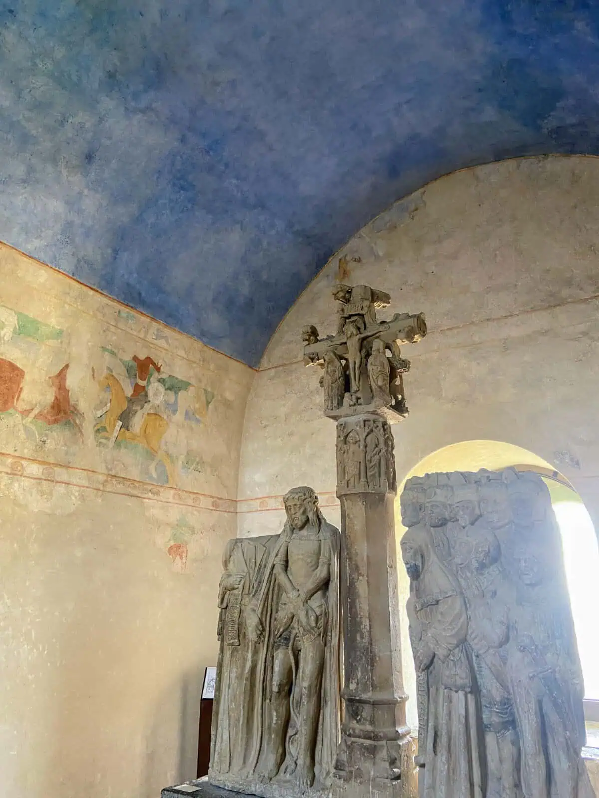 Interior of the Carcassonne Castle with statues and painted walls 