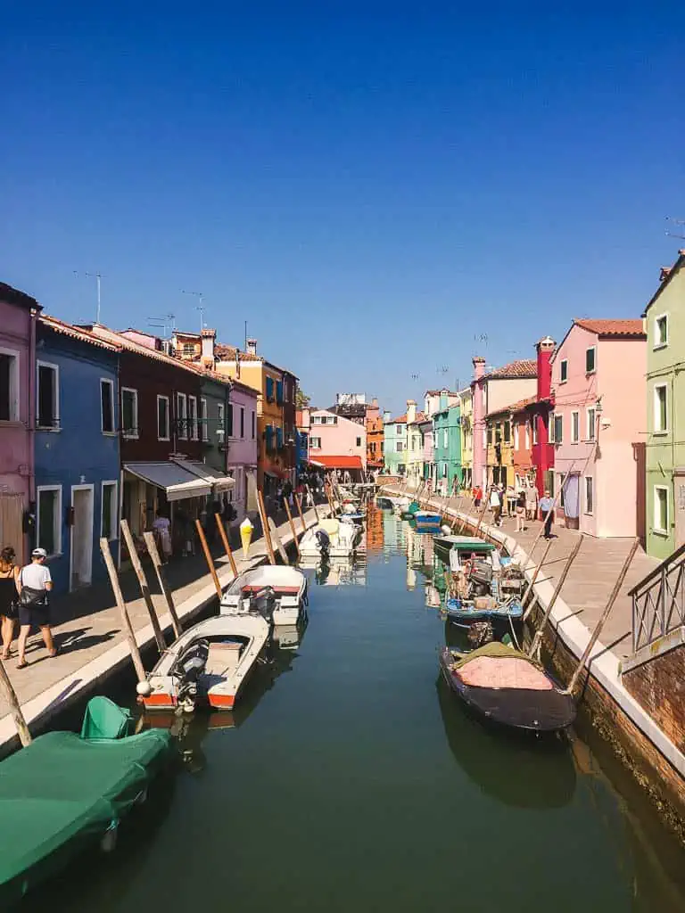 View of the canal and colourful houses in Burano off of Venice