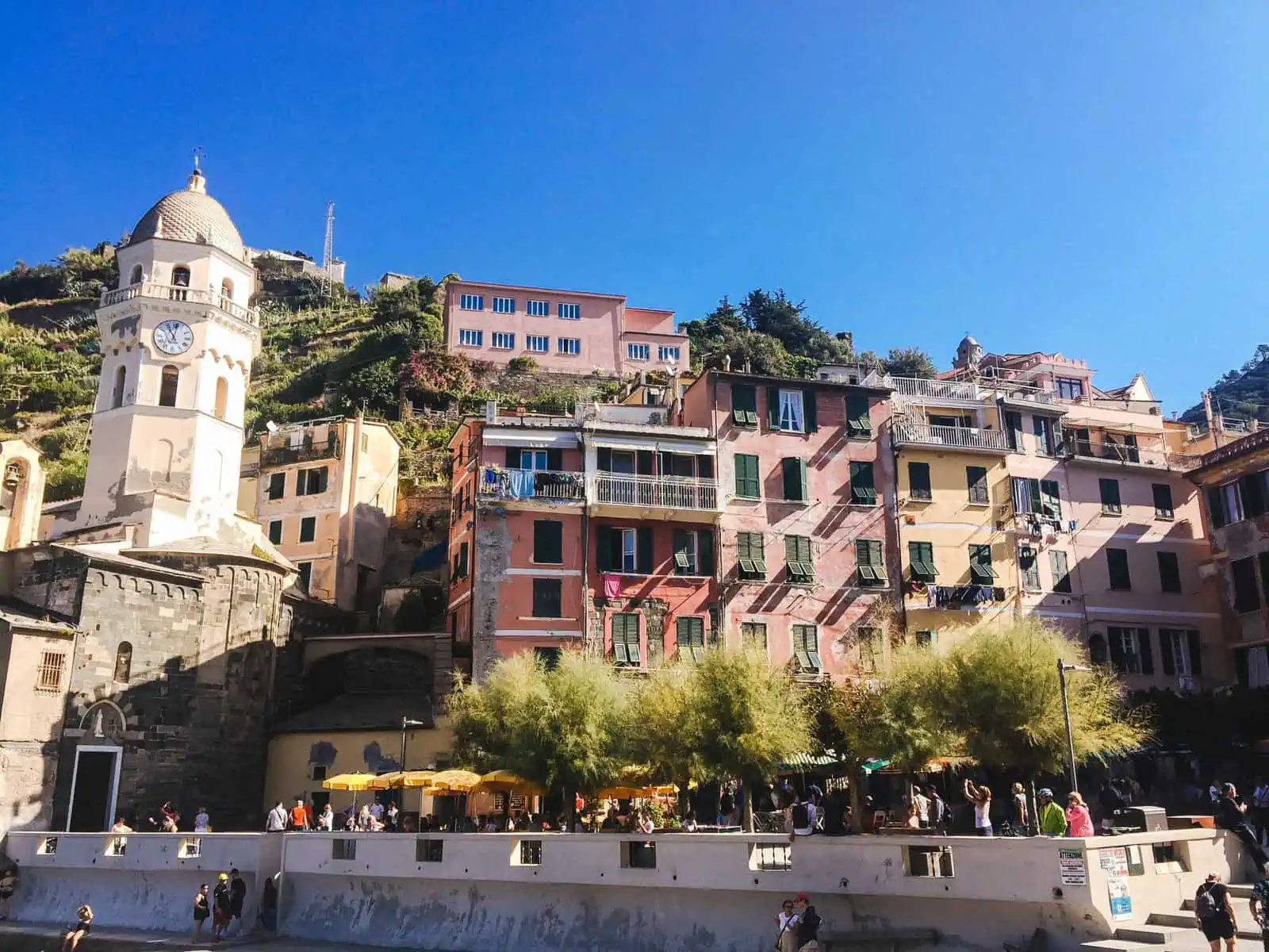 Buildings and the clock tower on the coast of Vernazza, Cinque Terre, Italy