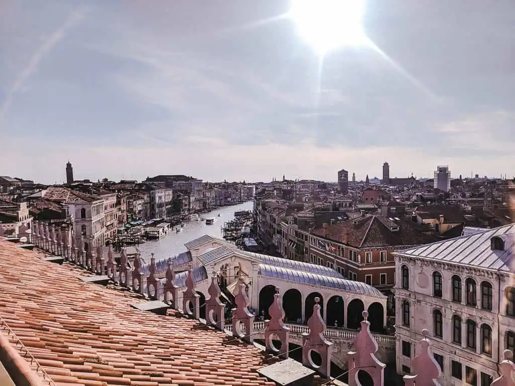 Rooftop view of Venice with the Rialto Bridge and canal in the distance