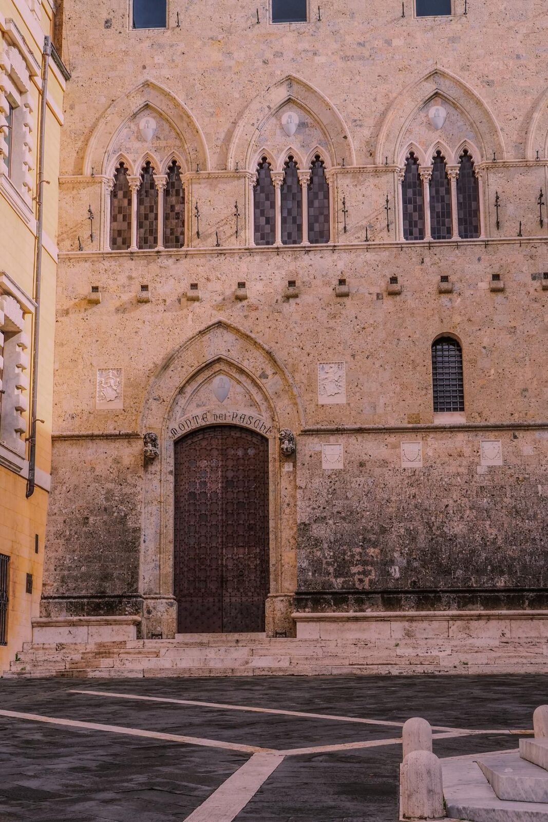 Medieval Siena architecture at sunset with arched doorways