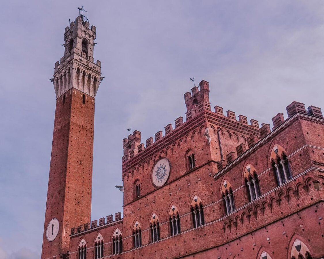 Twilight over Torre del Mangia and Palazzo Pubblico in Siena, Italy