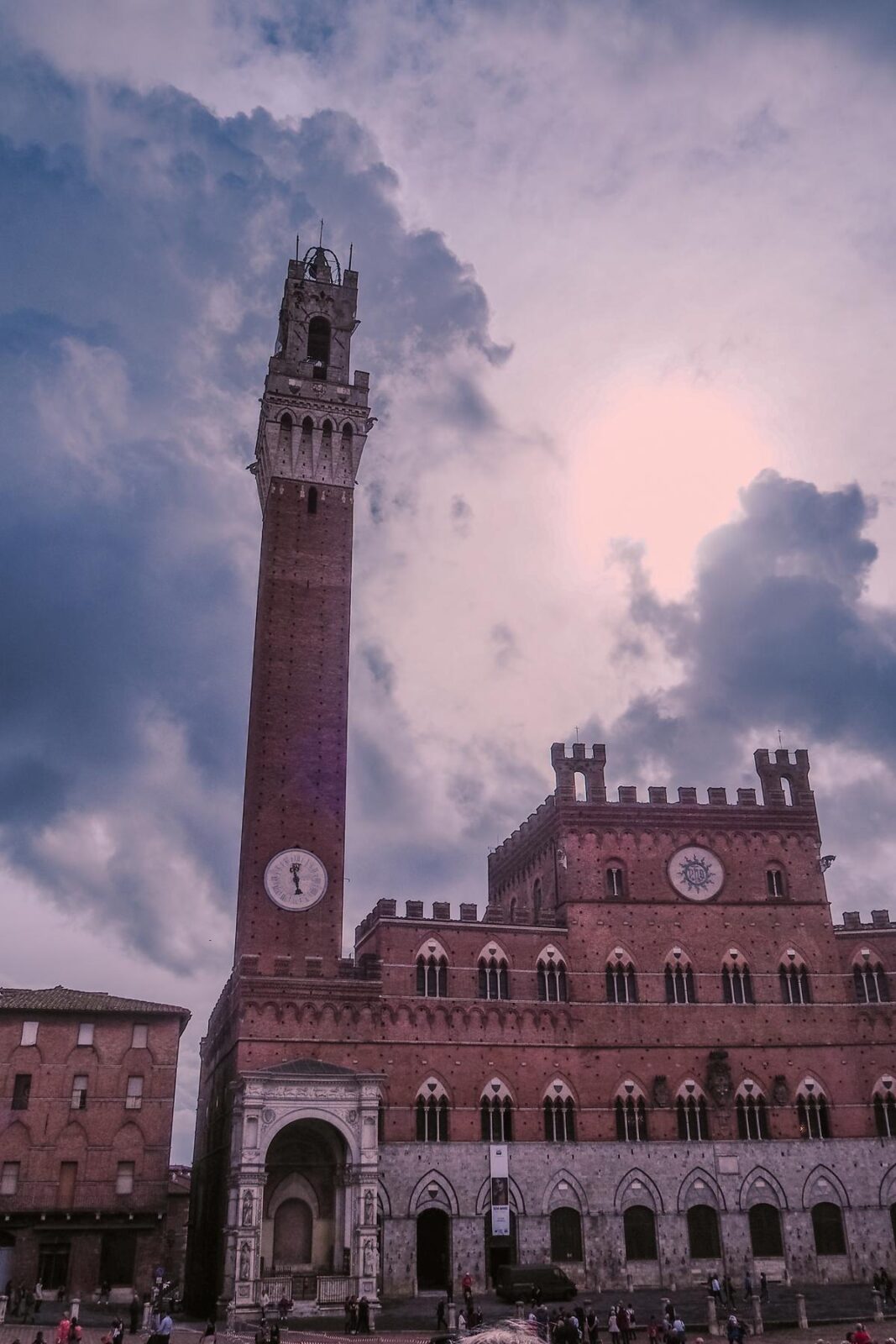 Sunset view of Torre del Mangia, Siena Italy, against a picturesque sky