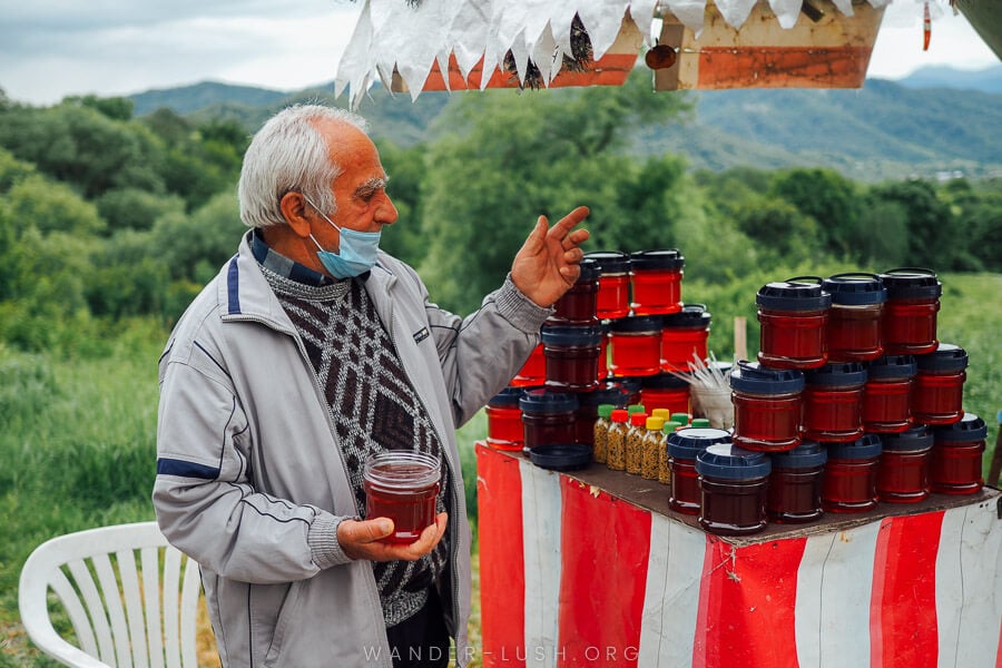 A man selling fresh honey on the Gombori Pass in Georgia.