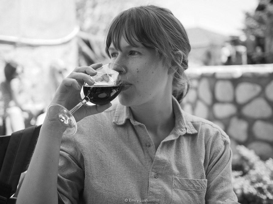 A woman sipping wine, one of the best things to do in Sighnaghi, Georgia.