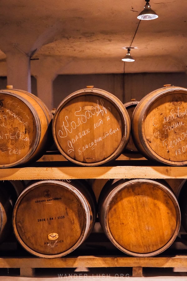 Oak barrels inside an underground spirit tunnel in Kakheti, Georgia.