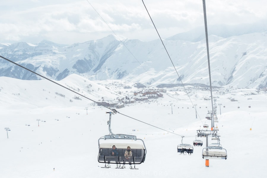 Skiers riding the lifts in Gudauri, Georgia.