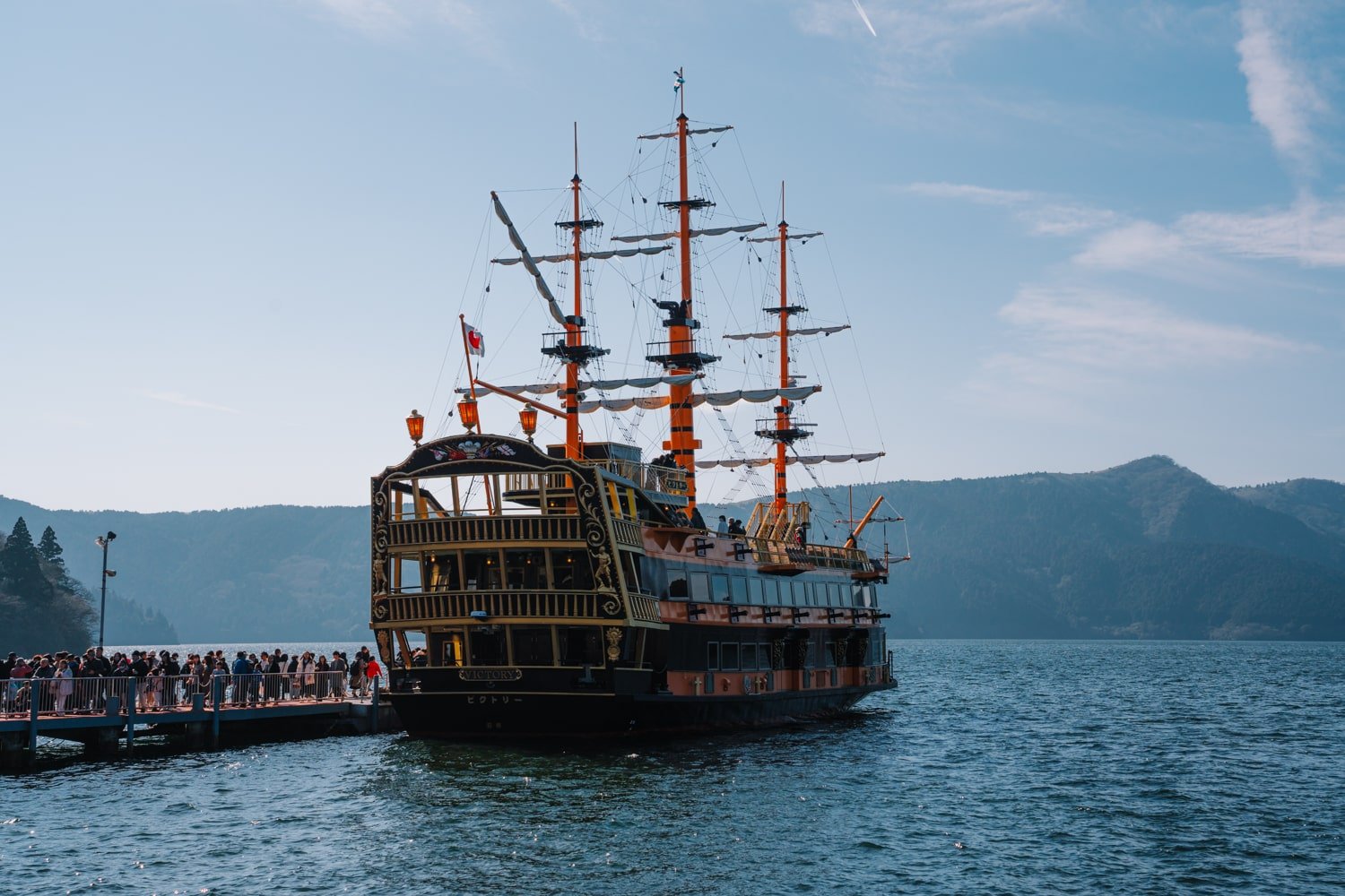 Tourists wait to board the pirate-theme Lake Ashi boat cruise in Hakone, Japan.