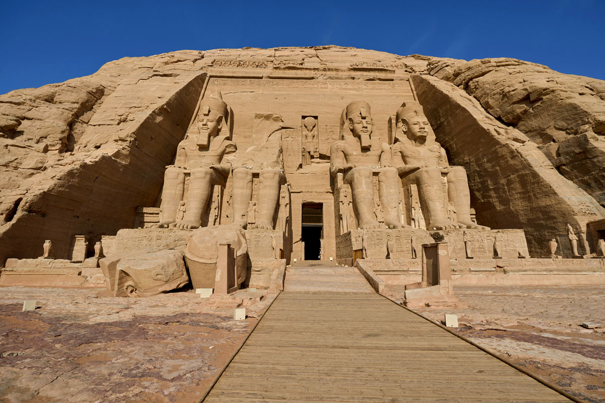 The enormous temple at Abu Simbel with statues of Ramses II at the entrance in Egypt.