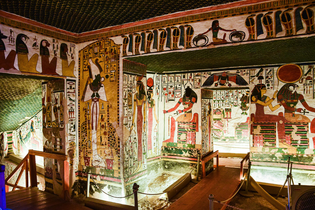 The inside of the richly decorated tomb of Nefertari at the Valley of the Queens in Luxor portrays gods and funerary scenes in bright colors on a background of white. 