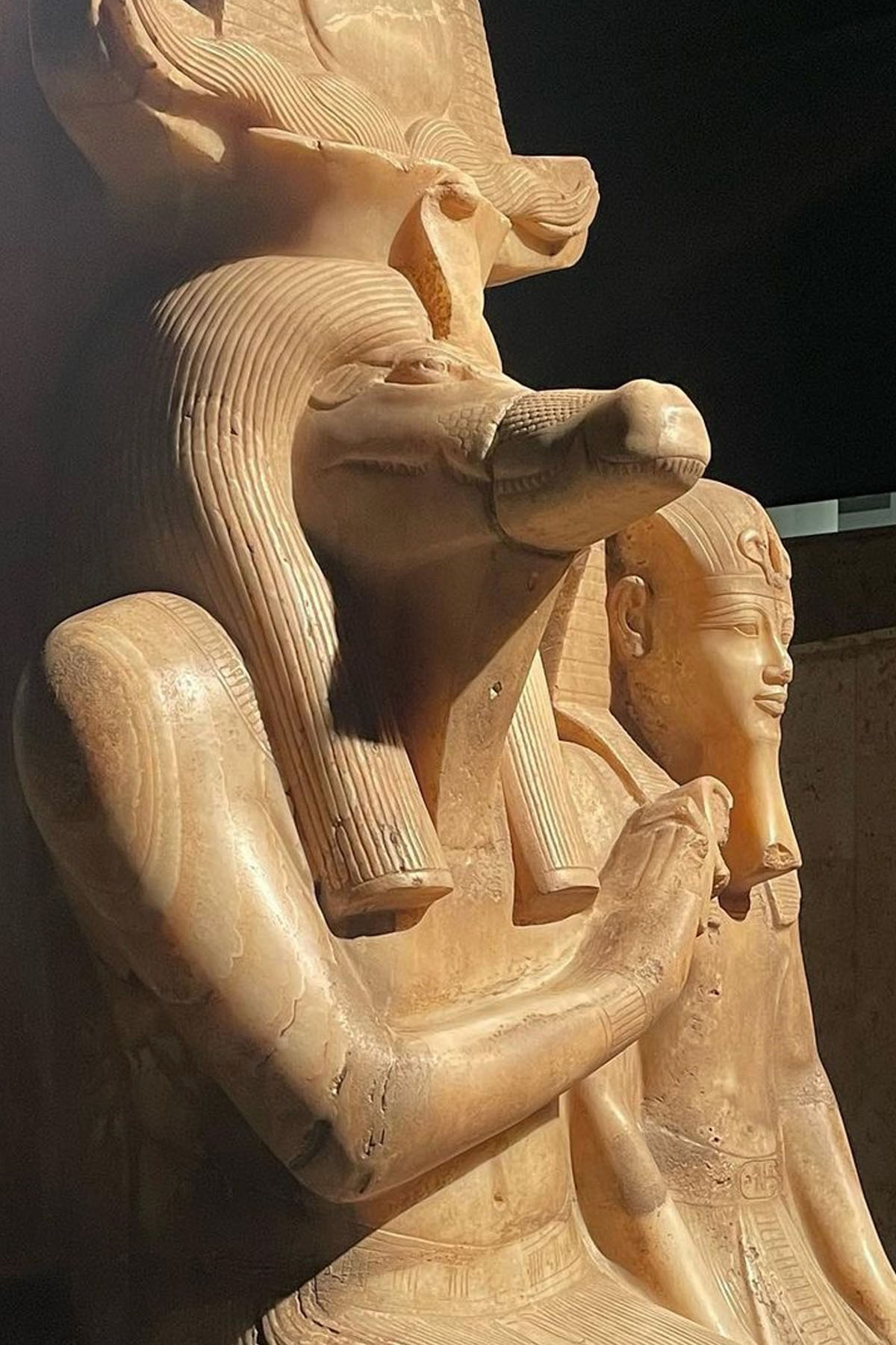 A statue of Sobek with a pharaoh inside the Luxor Museum in Egypt. 