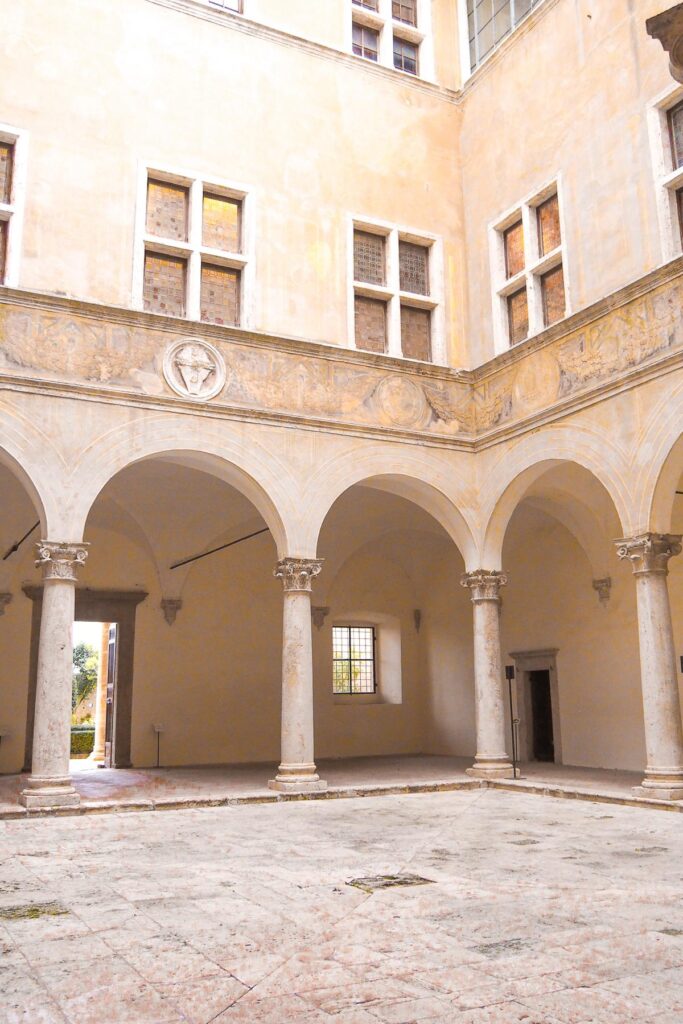 Palazzo Piccolomini's Renaissance porticos in Pienza, Italy, showcasing classical beauty and Italian heritage.