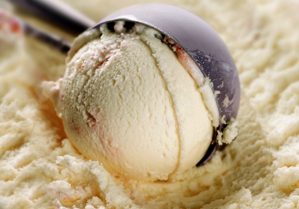 ice cream being scooped out with an ice cream scoop 