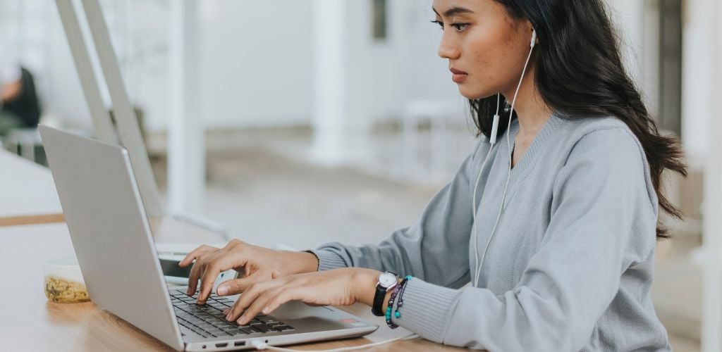 remote working, working at laptop from a home space - featured image