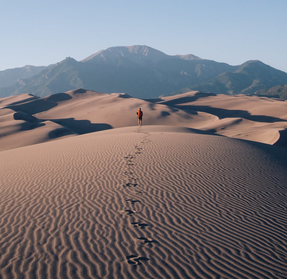 Solo traveler exploring a desert landscape