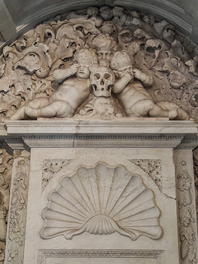 Intricate carved marble cherubs and skull at Royal Palace Amsterdam interior