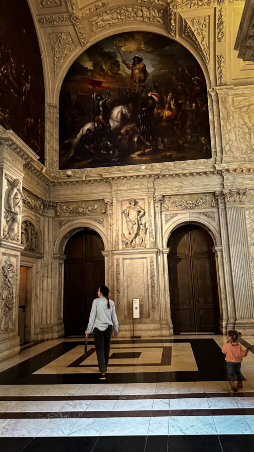 Mother and child touring Royal Palace of Amsterdam 