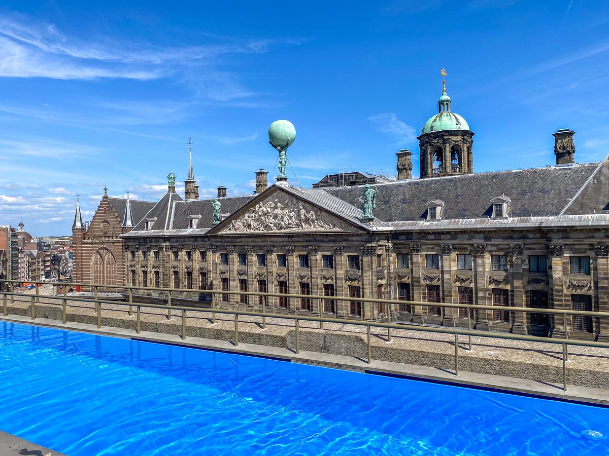 W Amsterdam rooftop pool with panoramic city views of the Royal Palace