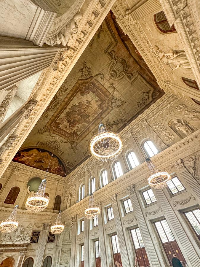 Elaborate ceiling and chandeliers in the Citizens' Hall of the Royal Palace Amsterdam interior