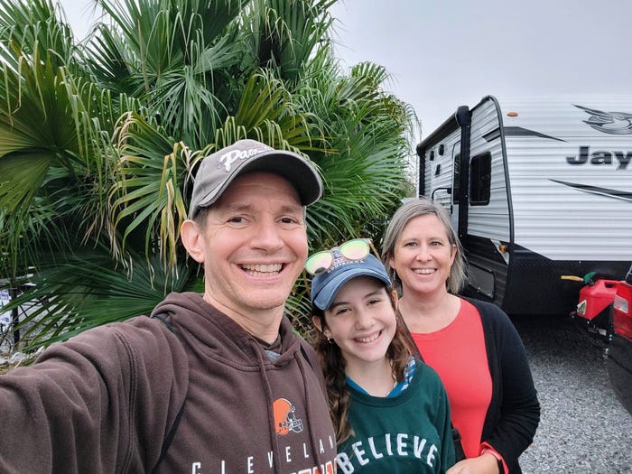 Jim White and his family next to their RV