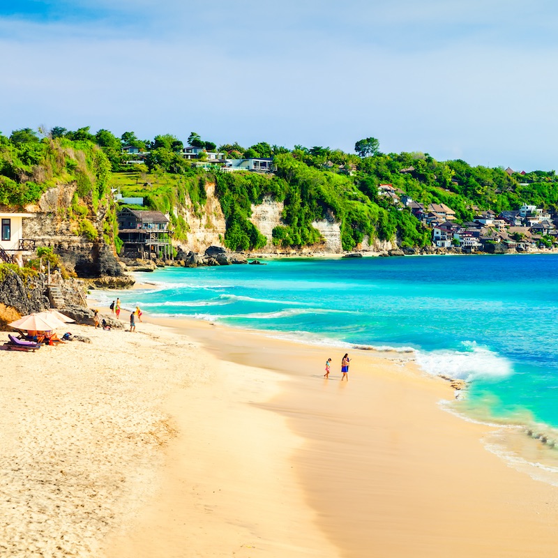 Bali seascape with huge waves at beautiful hidden white sand beach. 