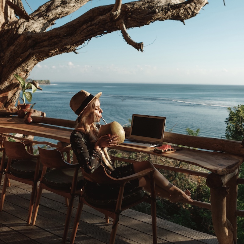 traveler nomad bali beach laptop