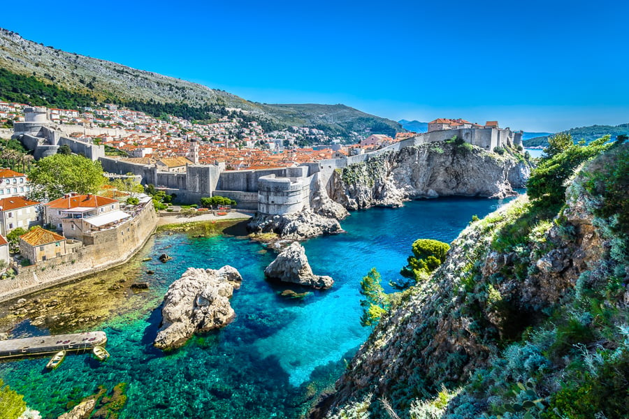 the city of Dubrovnik with the castle walls and blue sea water