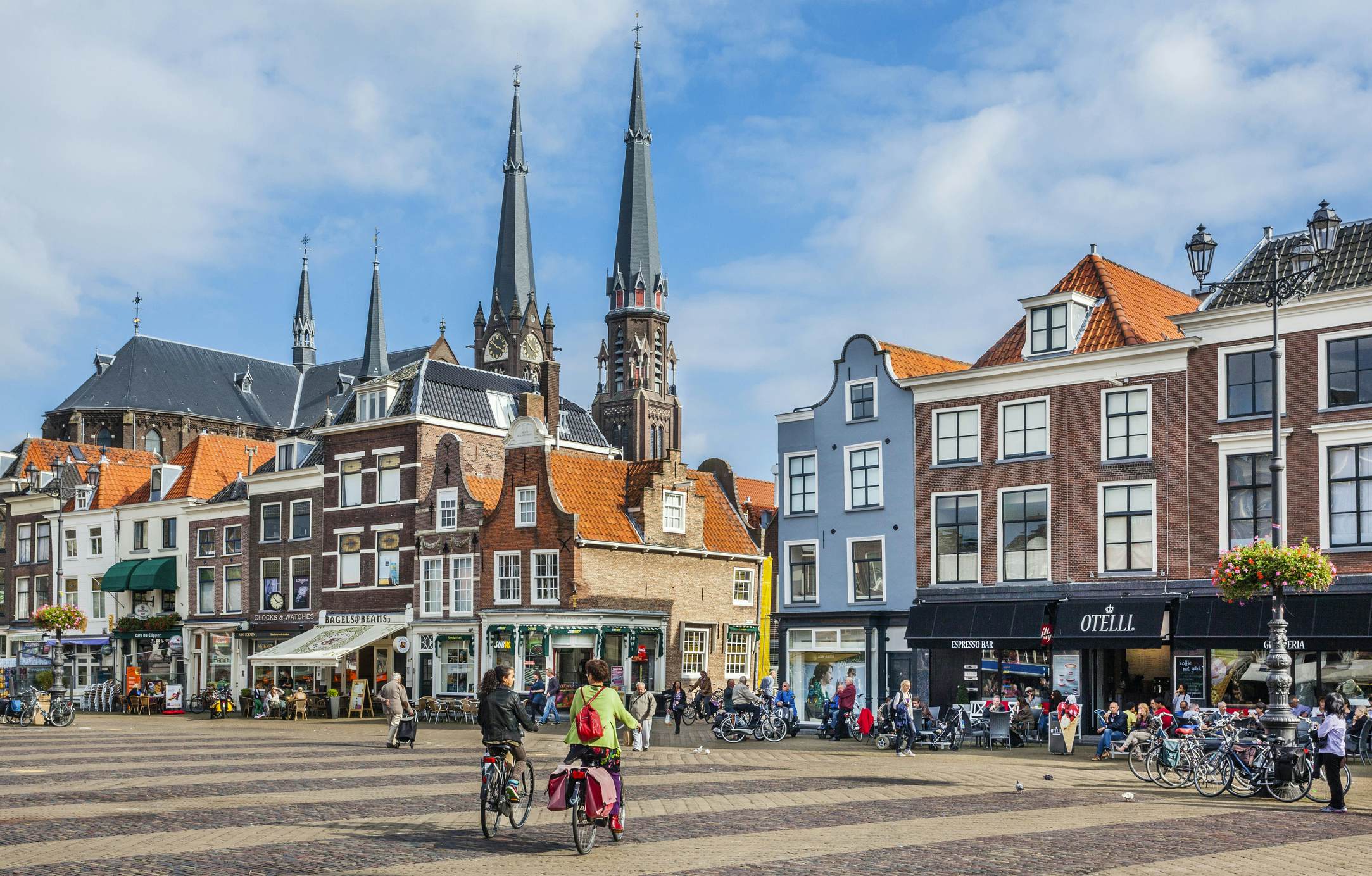 People in a city square 