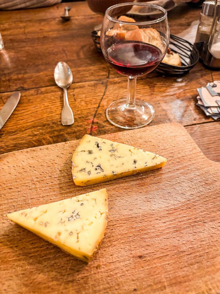 Authentic Parisian cheese and wine tasting experience in a rustic Paris bistro