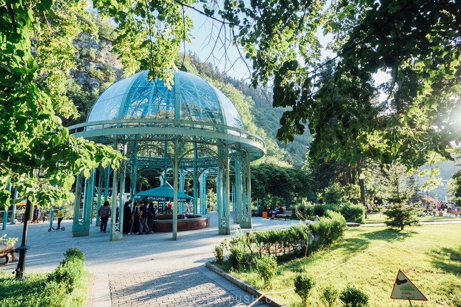The original Romanov spring inside a blue glass pavilion inside Borjomi Central Park in Georgia.
