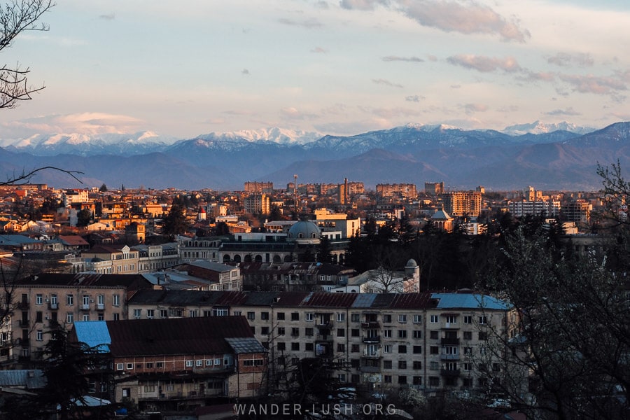 A view of the city of Kutaisi, with a backdrop of mountains.