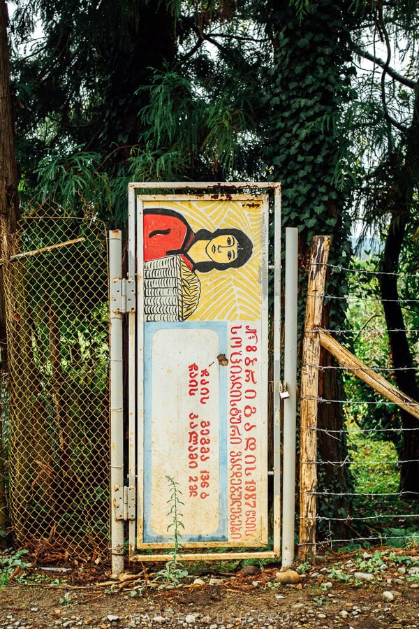 A poster decorates the gate to a tea plantation in Guria, Georgia.