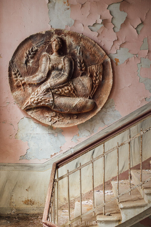 Shroma Culture House, a Soviet-era building with a stone medallion and pink walls.