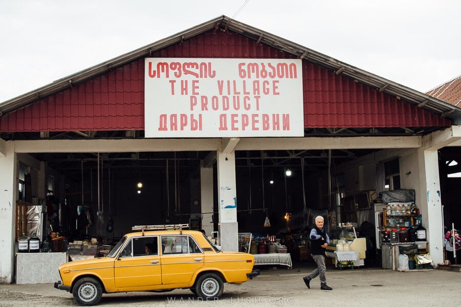 A yellow lada parked in front of the market in Kobuleti.