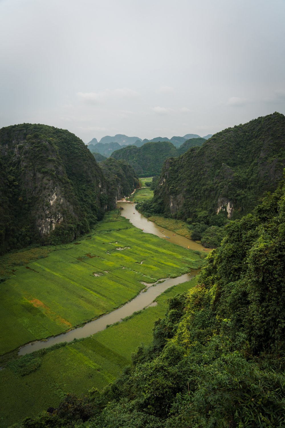 View of Tam Coc, mountains, and Ngao Long River from atop Hang Mua (Mua Cave) in Northern Vietnam.