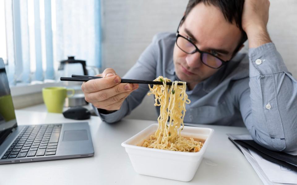 Man eating noodles