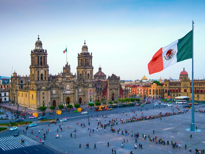 The Mexican flag flies over the Zocalo, the main square in Mexico City.