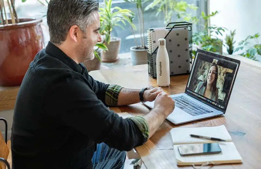 Man on virtual call on macbook