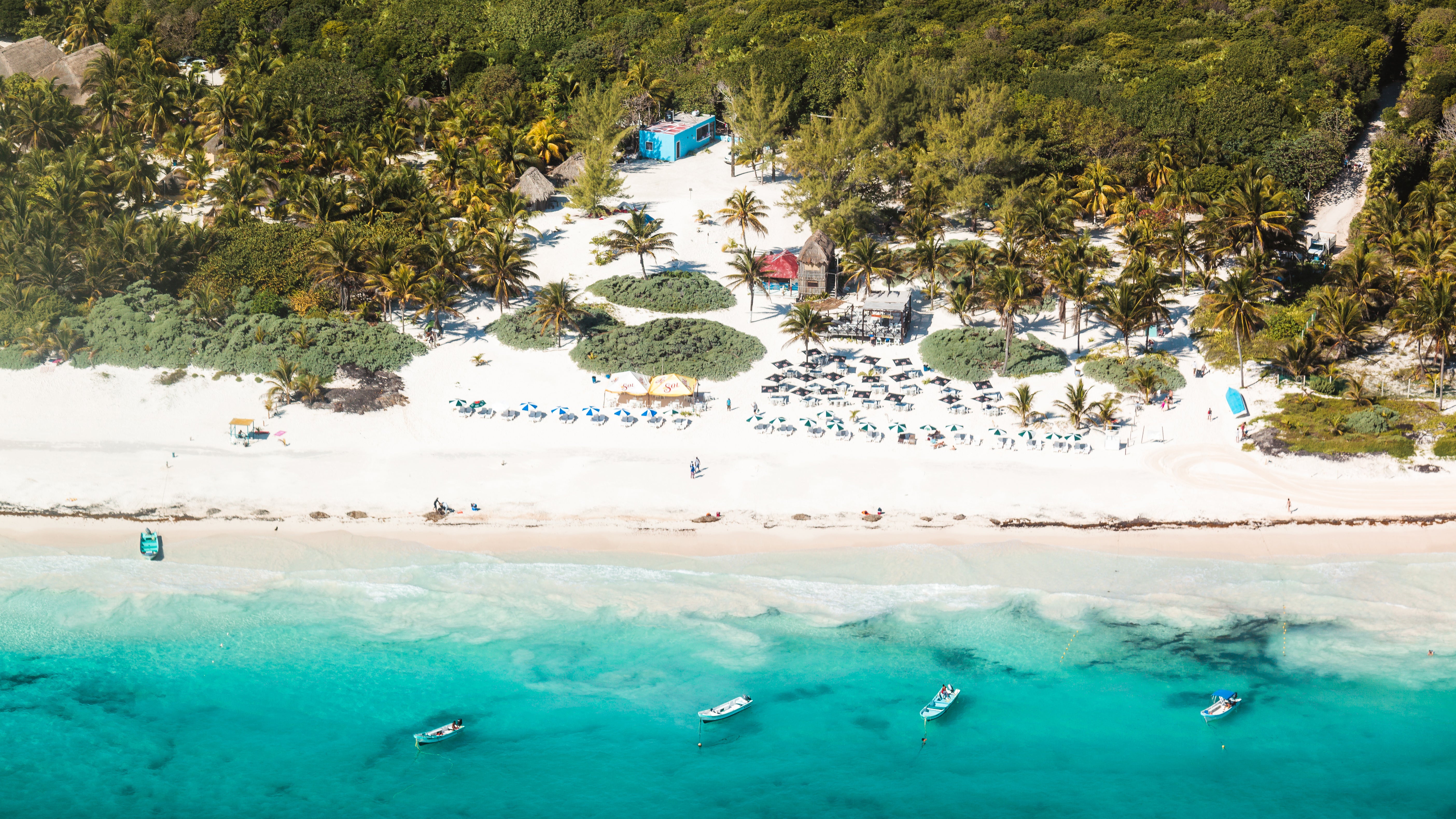 An aerial view show boats and umbrellas at a beach in Playa del Camren, Quintana Roo, Mexico. (Matteo Colombo via Getty Images)