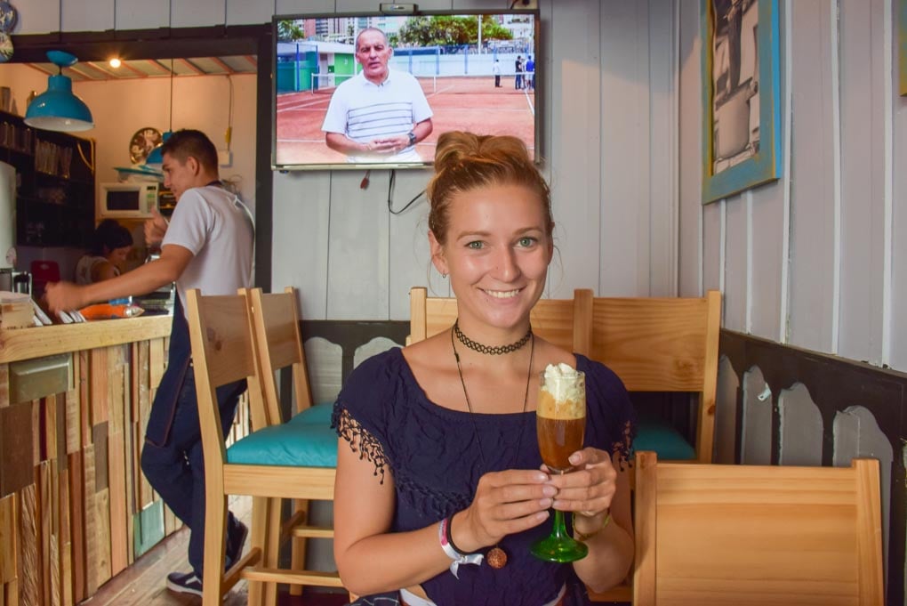 Bailey drinks a fancy coffee in Salento, Colombia