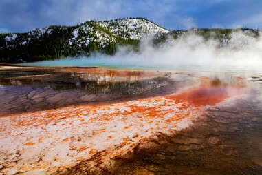 a steamy colorful prismatic lake at Yellowstone National Park