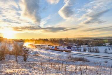 amtrak winter park express riding through snow