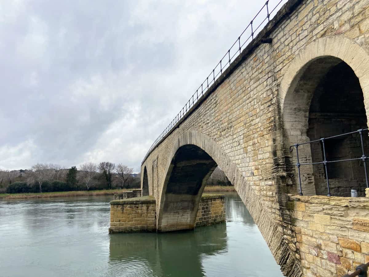 The Pont d'Avignon or  Pont Saint-Bénézet jutting out into the Rhone River in Avignon, France