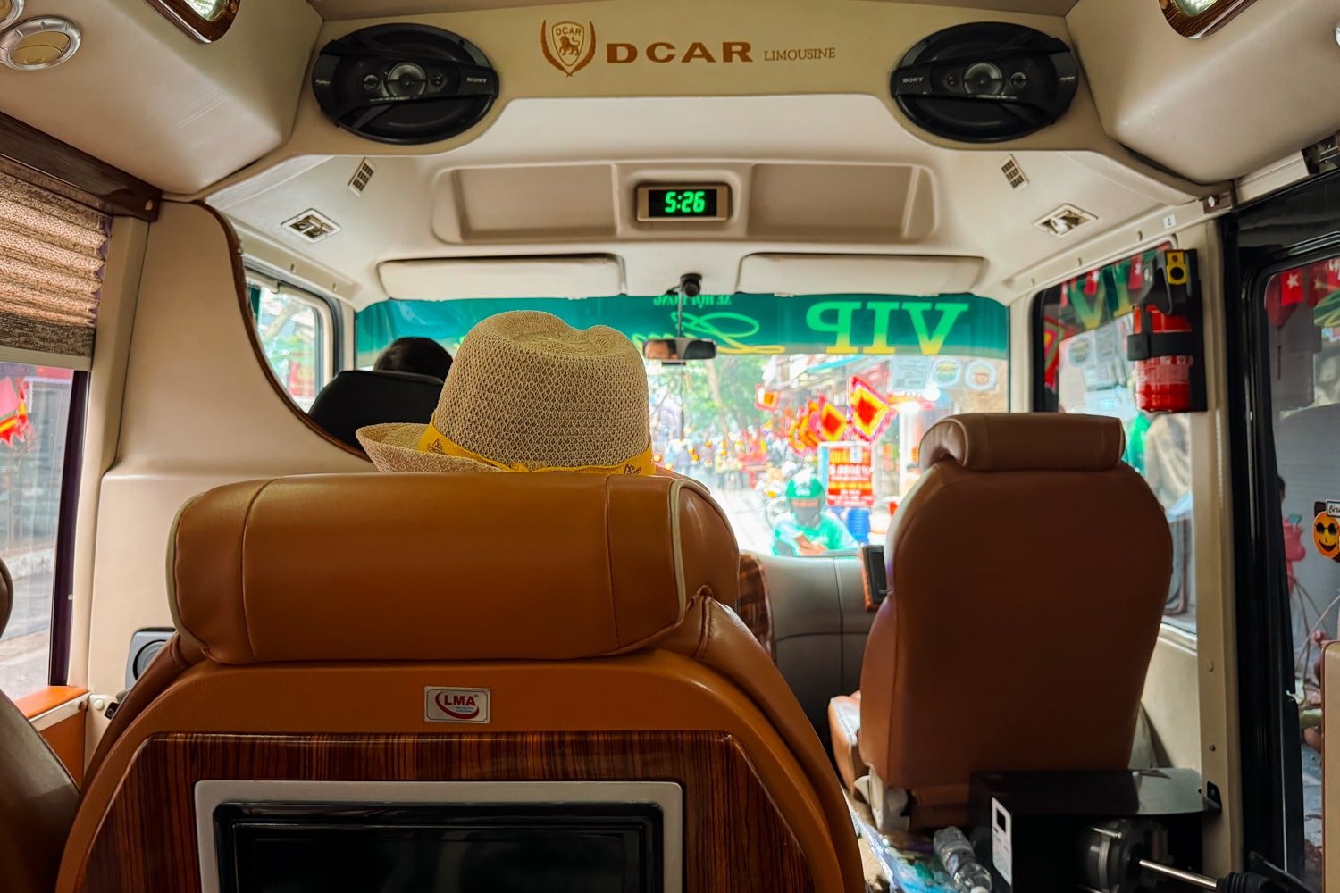 Tourist riding in limousine bus from Hanoi to Ninh Binh on a day trip.