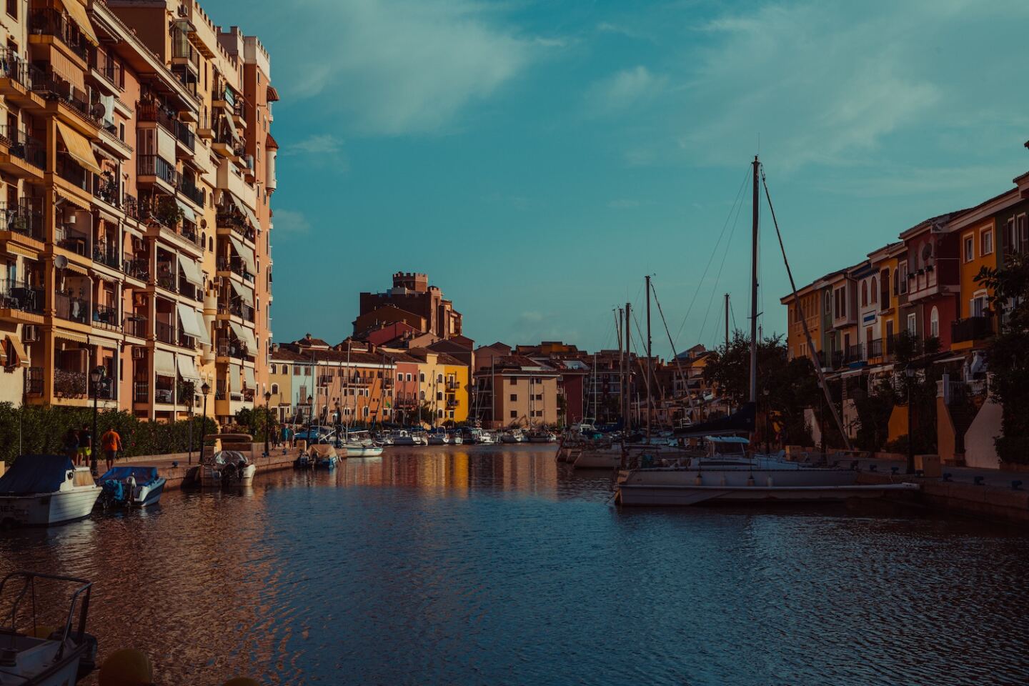 Colorful buildings along the waterfront with sailboats in Valenica, Spain