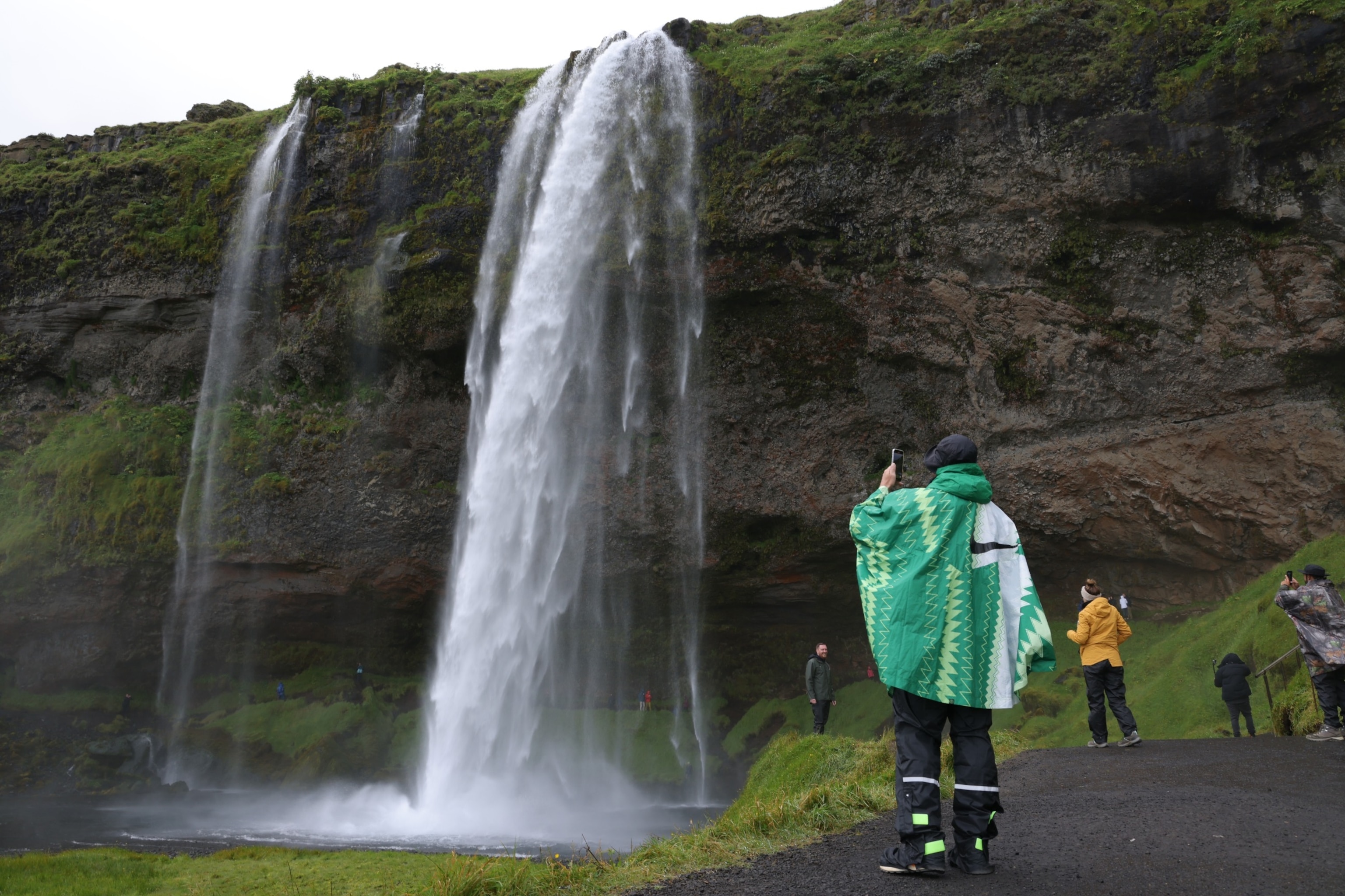 PHOTO: Tourists walk around Seljalandsfoss waterfall, Aug. 12, 2021, near Storidalur, Iceland. 